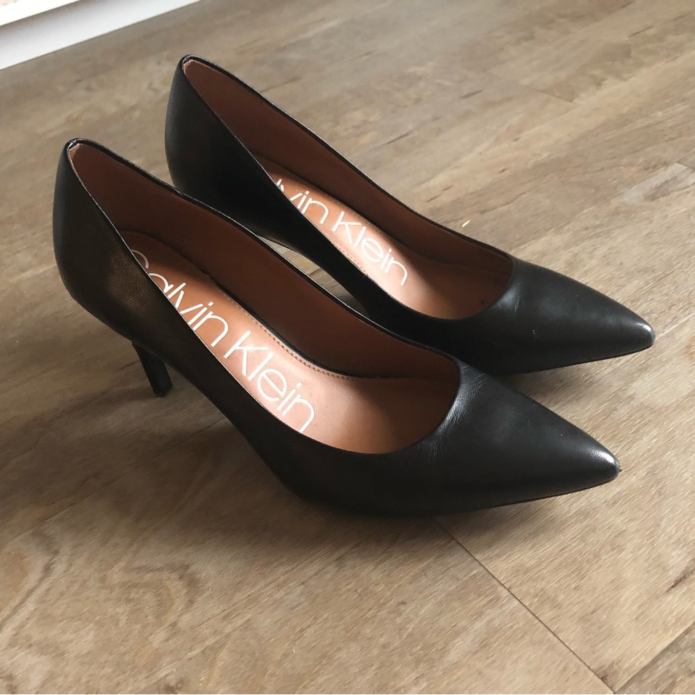 Calvin Klein heels in a size 7.5. Used condition with scuffs.